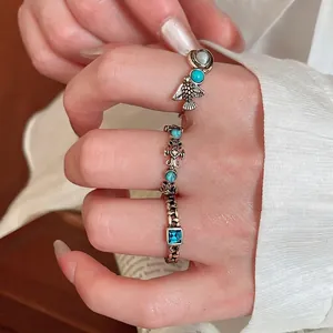 Vintage style bronze rings set with turquoise beads and square blue gemstone