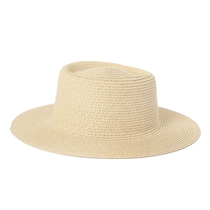 Close-up detail of the fine straw weave texture on a beige boater hat for sun protection