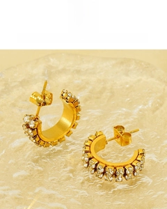 Detail of 18K gold plated C-shaped earrings with rhinestones, lead and nickel free