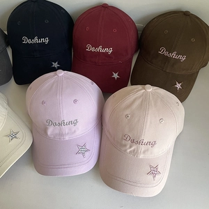 Detail view of cotton baseball caps featuring Dashing embroidery and star patch accents