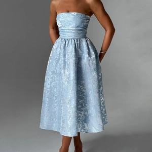 Detailed view of light blue tube dress with intricate white floral jacquard pattern