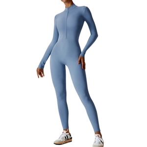 Slim fit light blue long sleeve yoga jumpsuit with front zipper and athletic tailoring