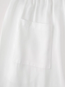 Detailed close-up of pocket stitching on white beaded embroidery shirt for women