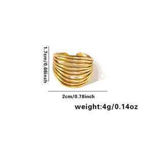 Detail view of gold multilayer spiral ring showing dimensions 1.7cm and weight 4g