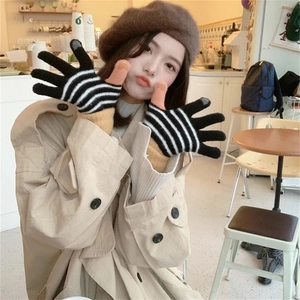 Detail of striped knitted touch screen gloves with khaki color-block accents and cuffs