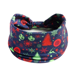 Detail of Christmas headband featuring reindeer and snowflakes on dark blue fabric