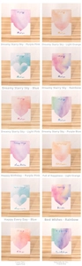 Detail view of 12 watercolor heart greeting cards with English blessings on wood background