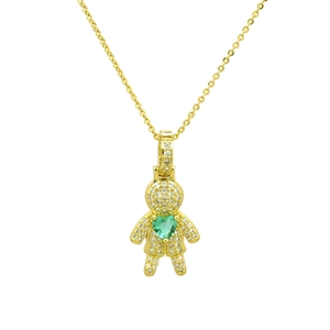 Close-up of gold heart pendant necklace featuring green gemstone and white zircons