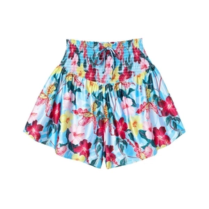 Détail d'un short froncé à taille haute avec imprimé floral tropical et lien à nouer