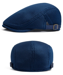 Detail of navy blue mesh beret showing breathable fabric and adjustable metal buckle