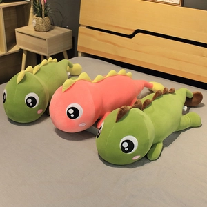Adorable green and pink plush dinosaur pillows for sleeping on bed as soft birthday gifts