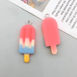Macro detail of colorful resin ice cream pendants with gradient finish and metal loops