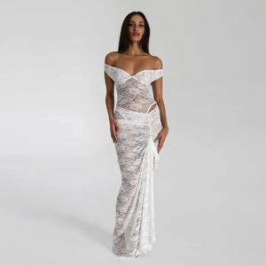 Detailed view of elegant white floral lace pattern on a stylish backless sleeveless maxi dress