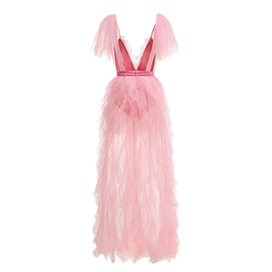 Detail of pink tiered tulle dress with deep V-neckline and intricate lace trim detailing