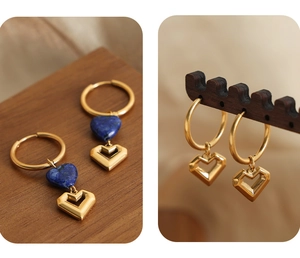 Detail of gold baroque heart earrings featuring blue natural stone and hollow pendants