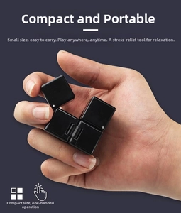 Macro view of portable black mirror infinity cube for stress relief and one-hand folding