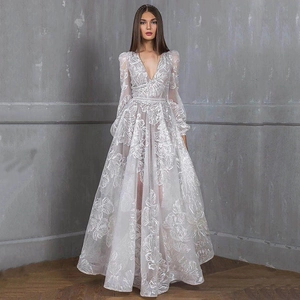 Detailed embroidery and delicate lace texture on white V-neck evening gown dress