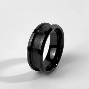 Detail of black tungsten carbide ring base with brushed center groove and beveled edges