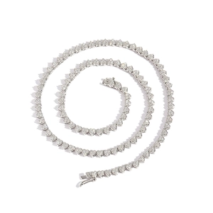 Macro view of silver heart link tennis chain with shimmering cubic zirconia stones