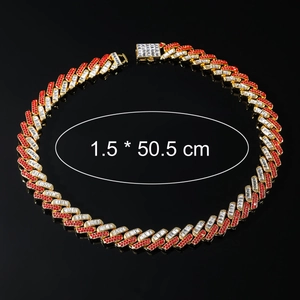Detail of 15mm gold Cuban link chain with red and white rhinestones and square clasp