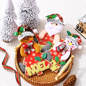 Festive Christmas tree ornaments featuring Santa, Snowman and Reindeer with bells