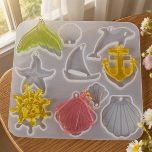 Macro shot of semi-transparent silicone mold and DIY resin ocean animal jewelry charms