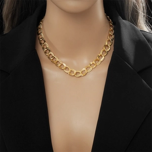 Golden double-loop chunky chain necklace in titanium steel on a model neck