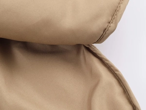 Close-up of khaki quilted padded jacket featuring neat stitching and durable fabric