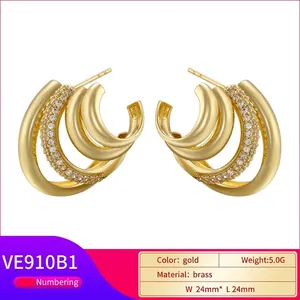 Golden multi-layer C-shaped hoop earrings with micro-inlaid zircons and brass texture