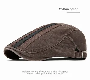 Detail view of coffee washed cotton flat cap with side straps and metal adjustable buckle