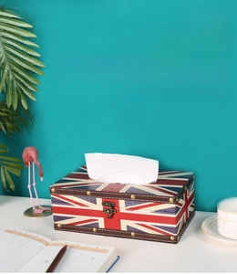 British flag tissue box with retro metal rivets and vintage leather texture on a white table