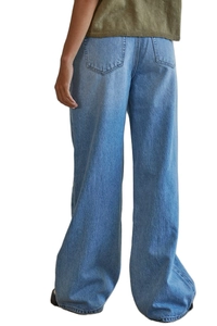 Detail of high waist fit and back pockets on washed blue wide leg denim jeans