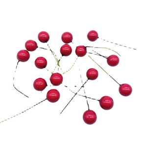 Artificial red berries on flexible wire stems for Christmas tree decoration and crafts