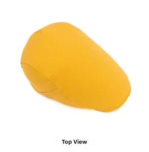 Top view of yellow cotton flat cap showing sturdy fabric and fine stitching detail
