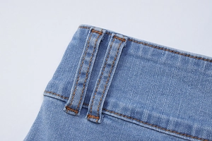 Detailed view of the double belt loops and stitching on these blue denim skirt sets