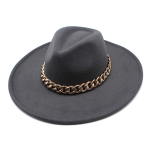 Detailed close-up of dark gray wool felt fedora with a thick golden metal chain accessory