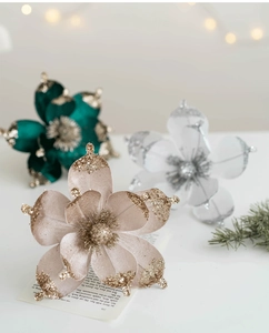 Close-up of champagne gold magnolia flower with glitter for Christmas tree decor