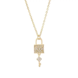 Golden key and lock pendant necklace with sparkling crystals on a minimalist chain