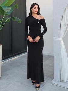 Elegant black off-shoulder knit dress with asymmetric neckline and gold button details