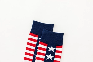 Detail view of cotton blend crew socks featuring American flag stars and stripes pattern