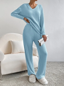 Detail of light blue ribbed knit loungewear set with V-neck top and straight pants