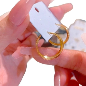Minimalist 18k gold plated round hoop earrings with textured diamond cut finish for women