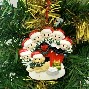 Family of 7 and golden retriever resin Christmas ornament hanging on green pine tree branch