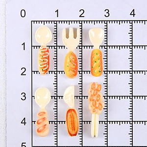 Detailed scale view of 6 miniature resin food charms on tiny forks and spoons