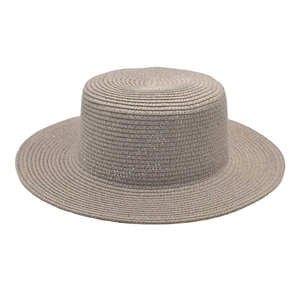 Detail of flat top boater straw hat featuring fine concentric weave texture in khaki