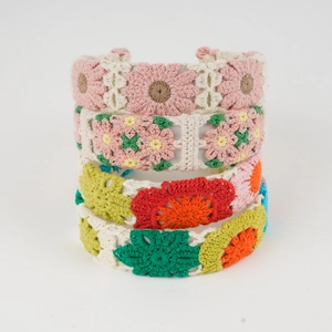 Handmade crochet floral headband with colorful knitted flower patterns for women