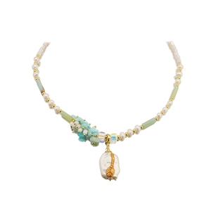 Baroque pearl pendant necklace with amazonite beads and gold leaf details on white background
