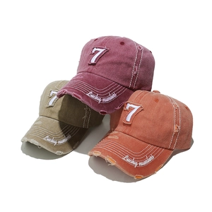 Distressed vintage baseball caps with number 7 embroidery in burgundy, khaki, and orange