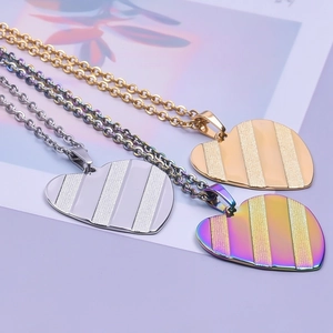 Polished 18k gold and rainbow heart pendants on O-chains in gold, silver, and iridescent hues