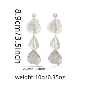 Detail view of silver tassel earrings showing dimensions 8.9cm length and leaf texture